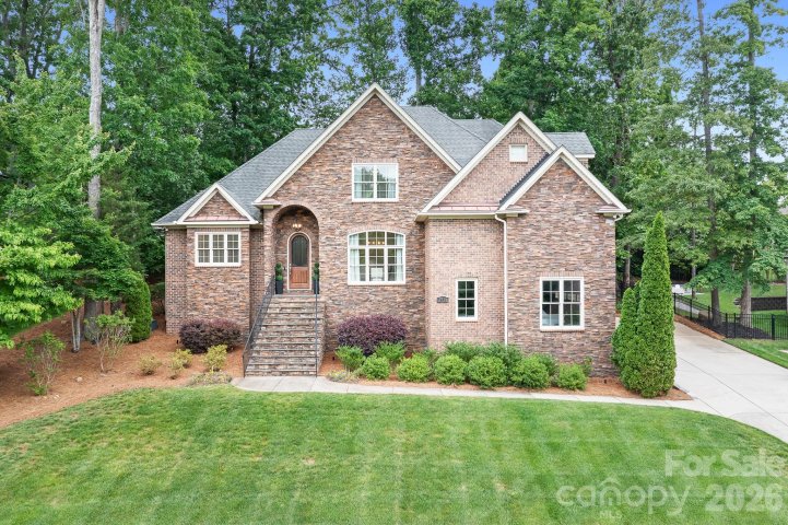 7738 Burning Ridge Drive active home in Treetops At Cowans Ford, Stanley, NC